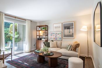 Spacious living room at brackett apartments in edmonds, wa 98020